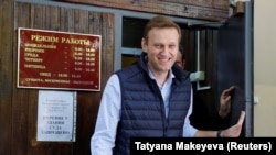 Russian opposition leader Aleksei Navalny walks out of a court building in Moscow on May 11.