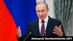 Затримана була довіреною особою Володимира Путіна (на фото) під час президентських виборів 2018 року