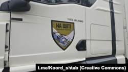 Автомобиль, перевозящий тела погибших
